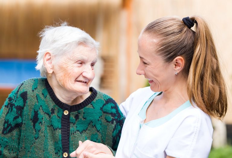 elderly woman with caregiver