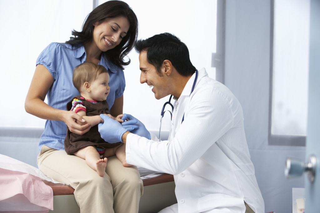 a doctor checking baby's health